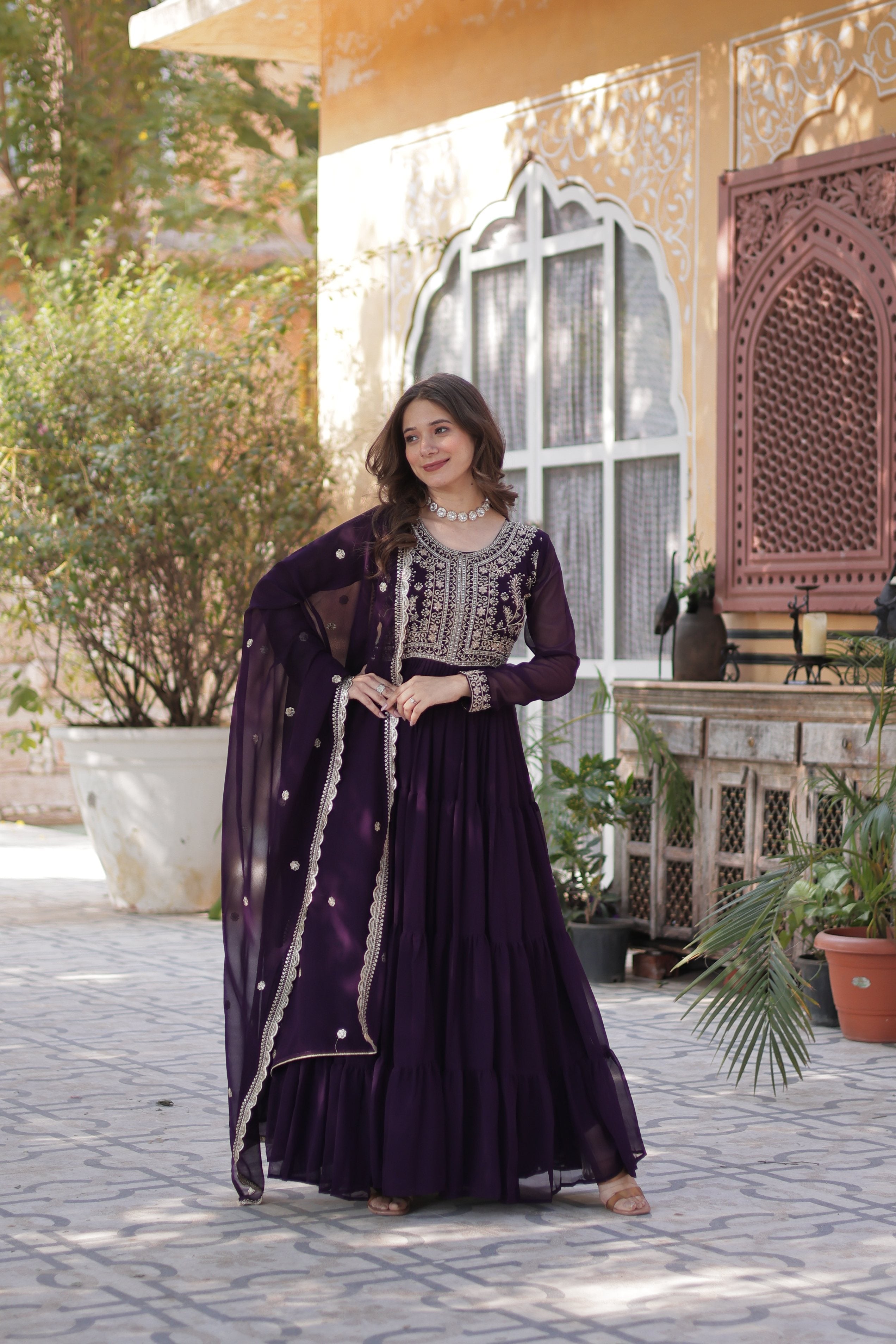 Wine-colored faux georgette Anarkali set with pearl work and high flare