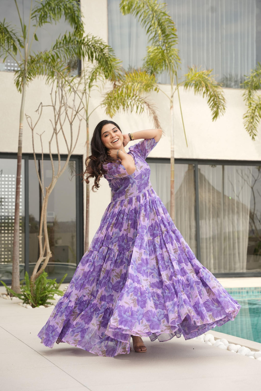 Purple floral print designer Anarkali gown in faux georgette with 12-meter flair