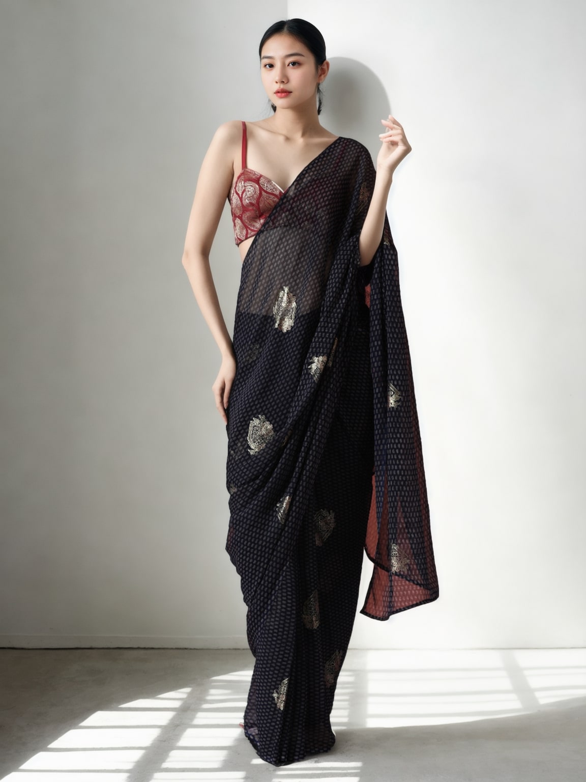 Women wearing a black marble chiffon ready to wear printed saree with matching blouse