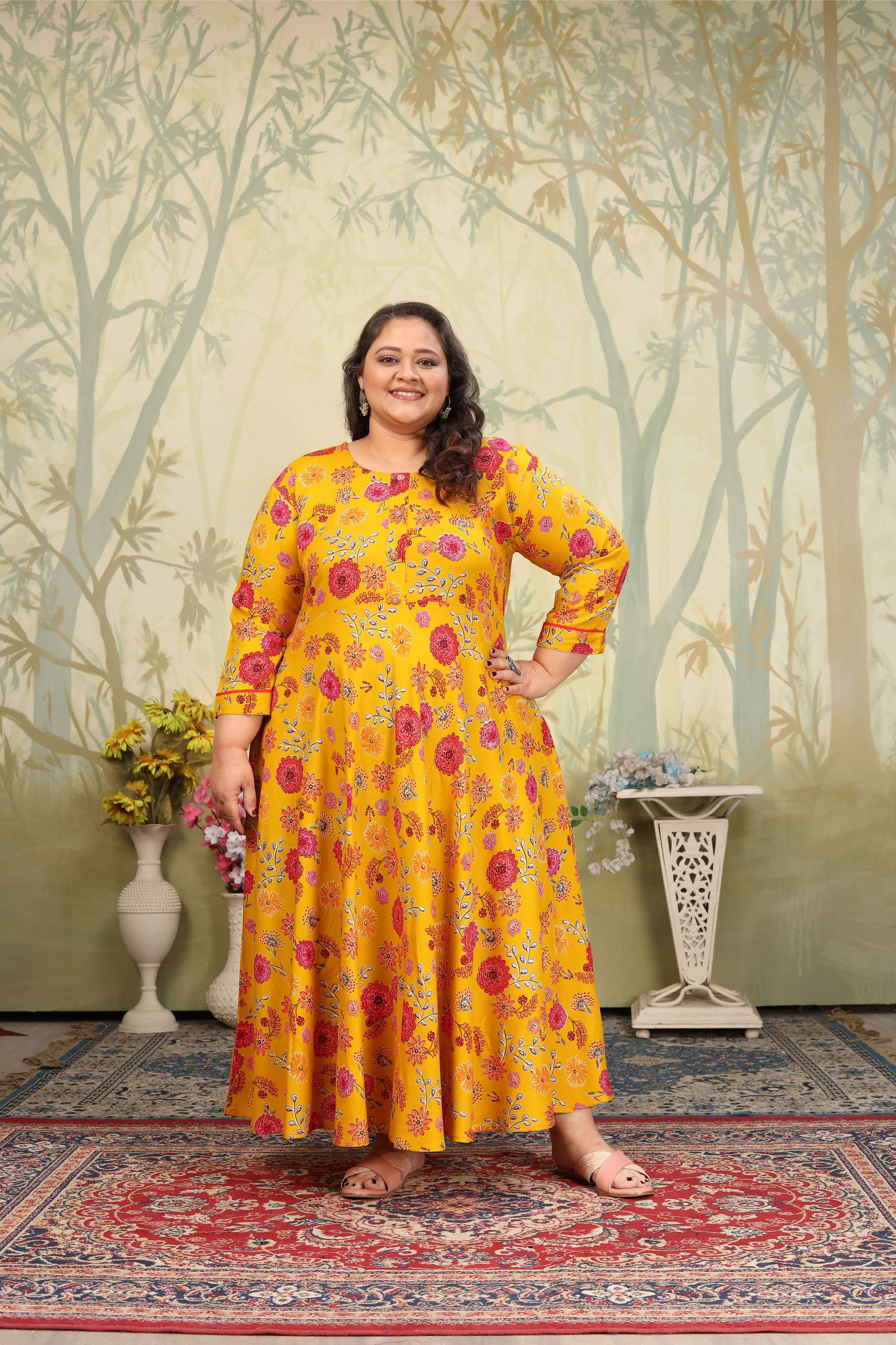 Bright yellow rayon Anarkali featuring floral prints and sequin accents