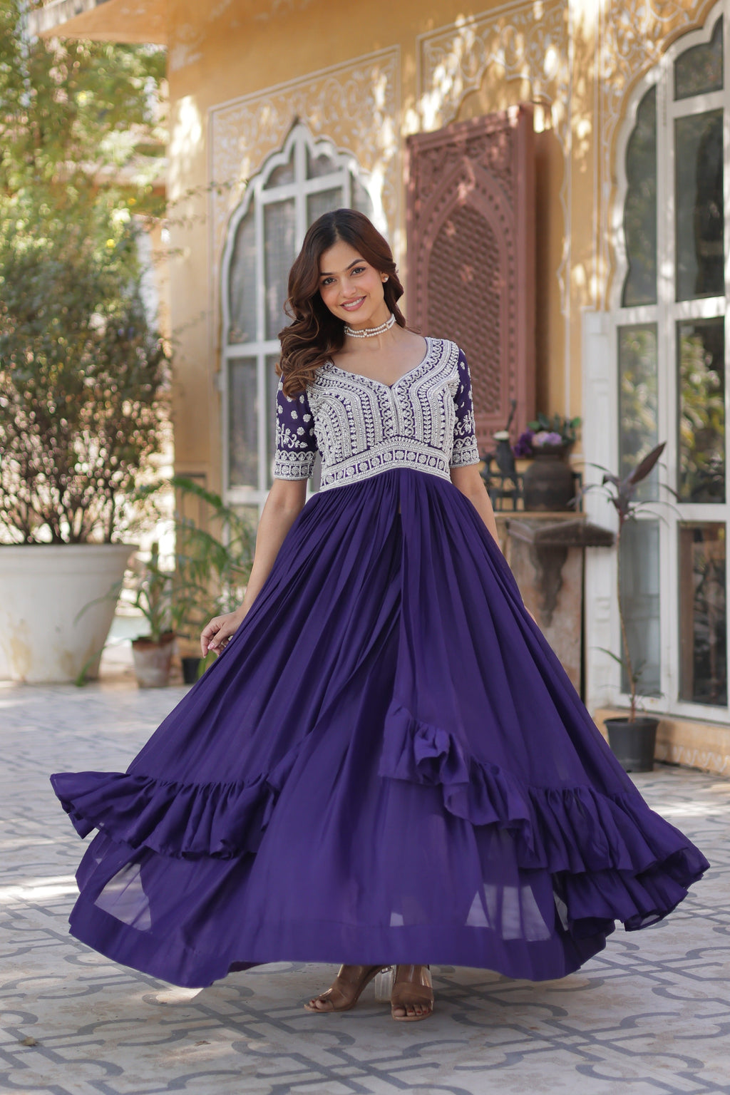 Women's Purple Star Georgette Anarkali set with sequin and bead embroidery, featuring a 3.5m flair and pan neck.