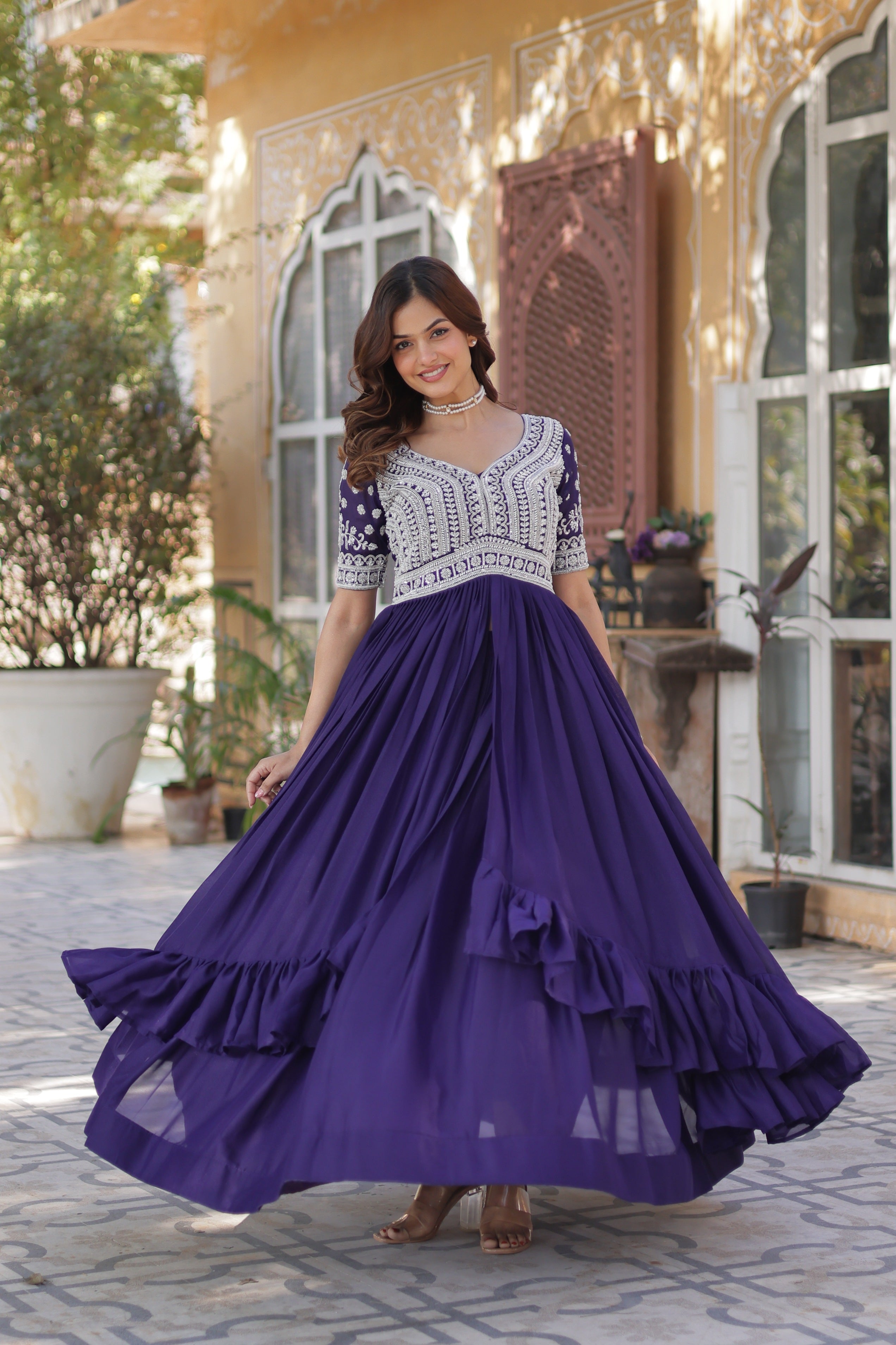 Women's Purple Star Georgette Anarkali set with sequin and bead embroidery, featuring a 3.5m flair and pan neck.