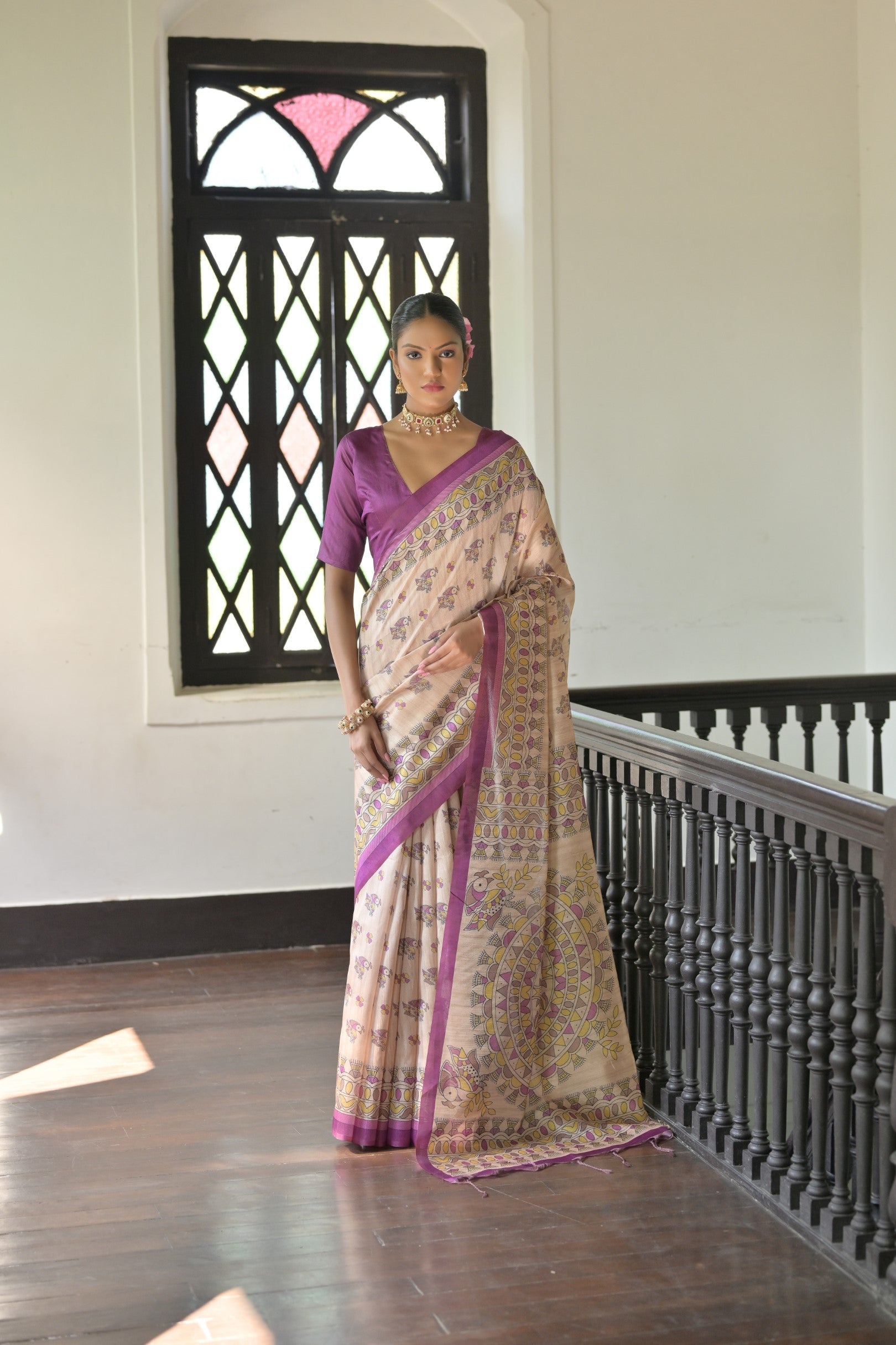 Wine-colored soft Tussar silk designer saree with traditional Madhubani prints and unstitched blouse piece.