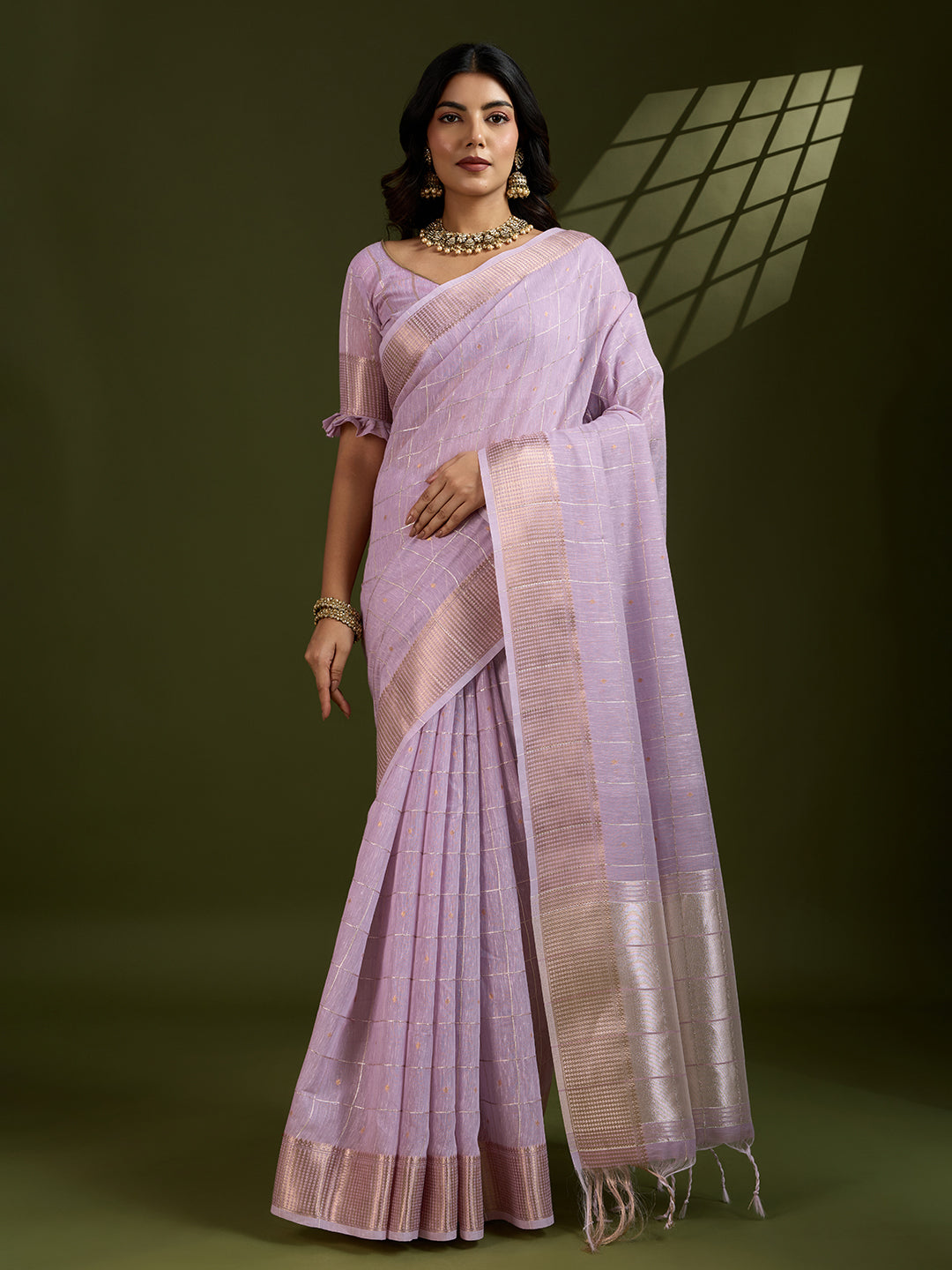 Elegant purple tissue linen silk saree with gold zari woven details and matching blouse piece