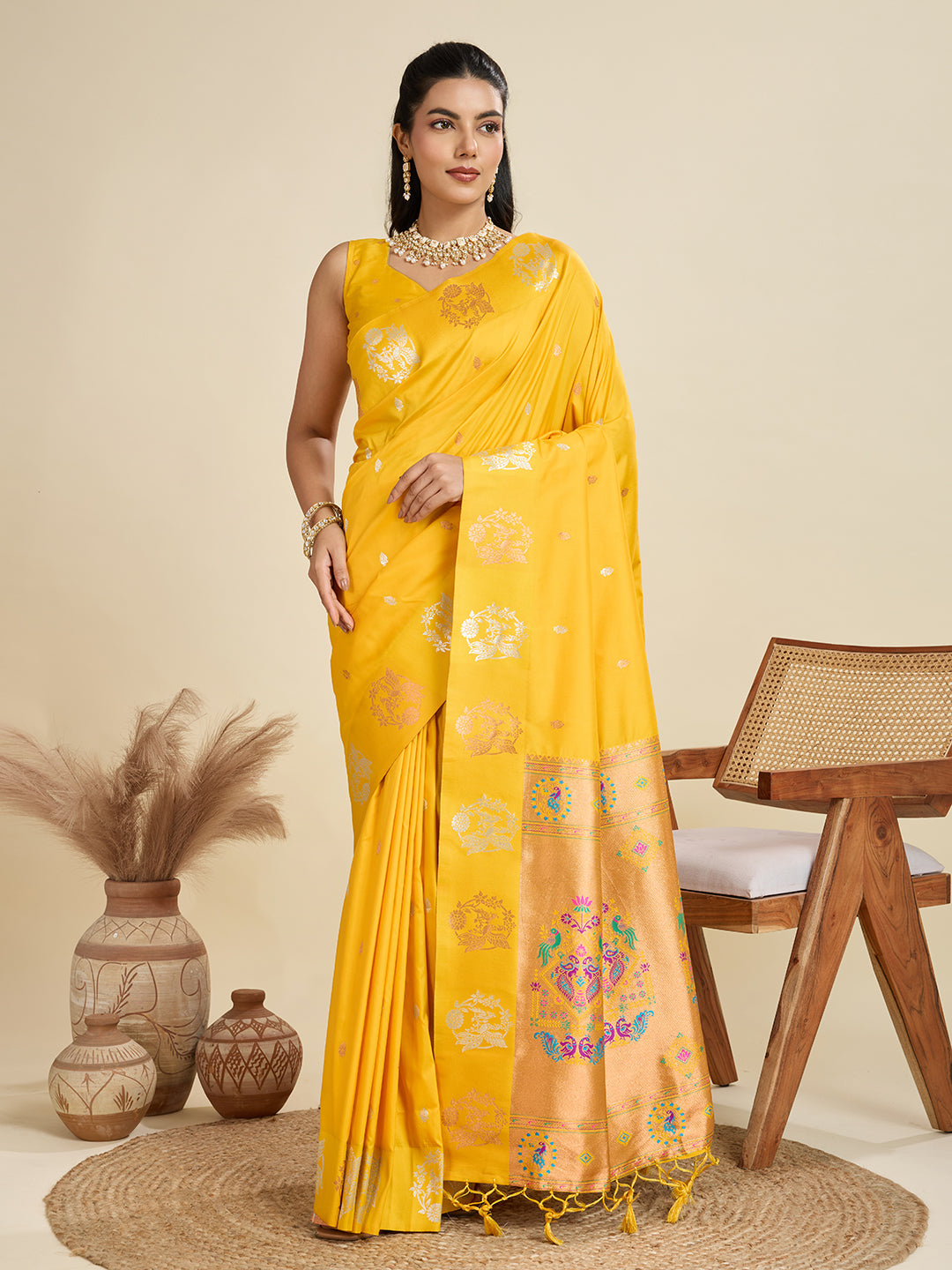 Vibrant yellow Kanjivaram Paithani silk saree with silver and gold zari work