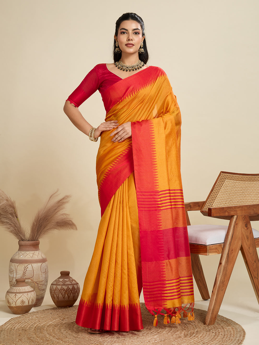 Mustard colored Khadi raw silk saree with temple woven border detail