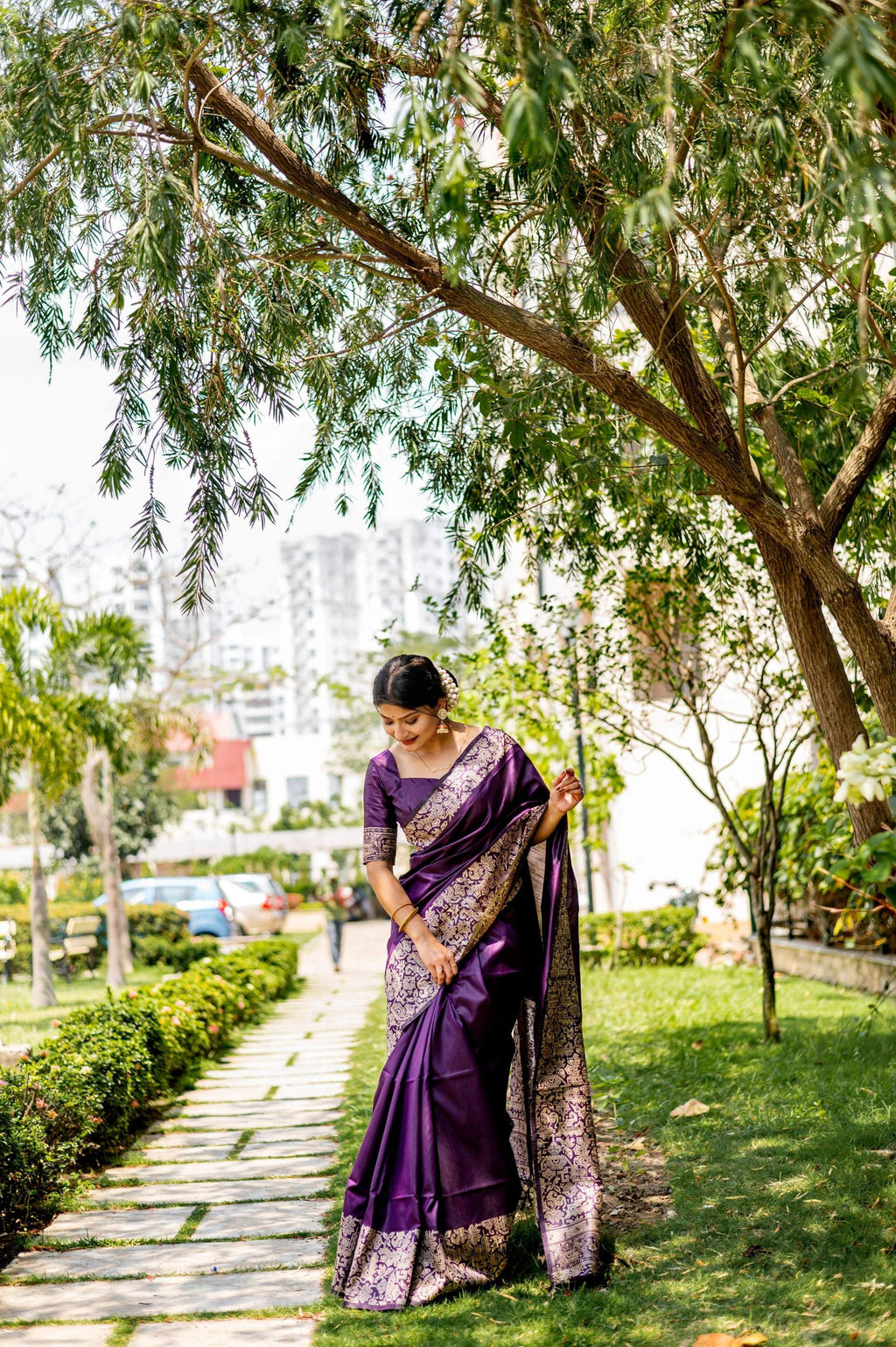 Deep wine colored handloom raw silk saree with intricate woven details