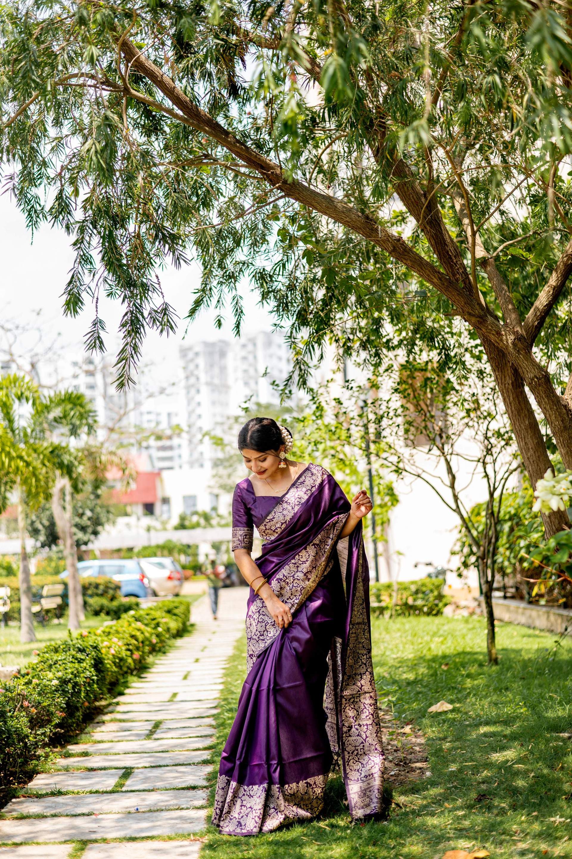 Deep wine colored handloom raw silk saree with intricate woven details