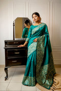 Rama colored handloom raw silk saree with detailed weaving patterns