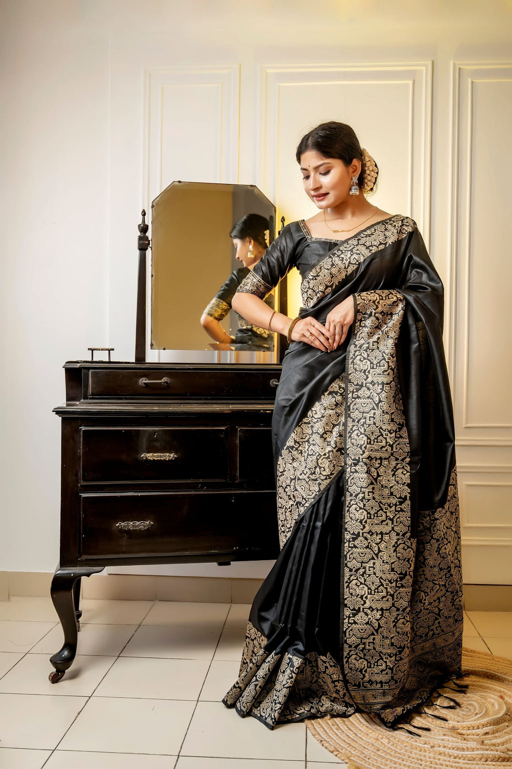 Black handloom raw silk saree with intricate weaving and designer finish