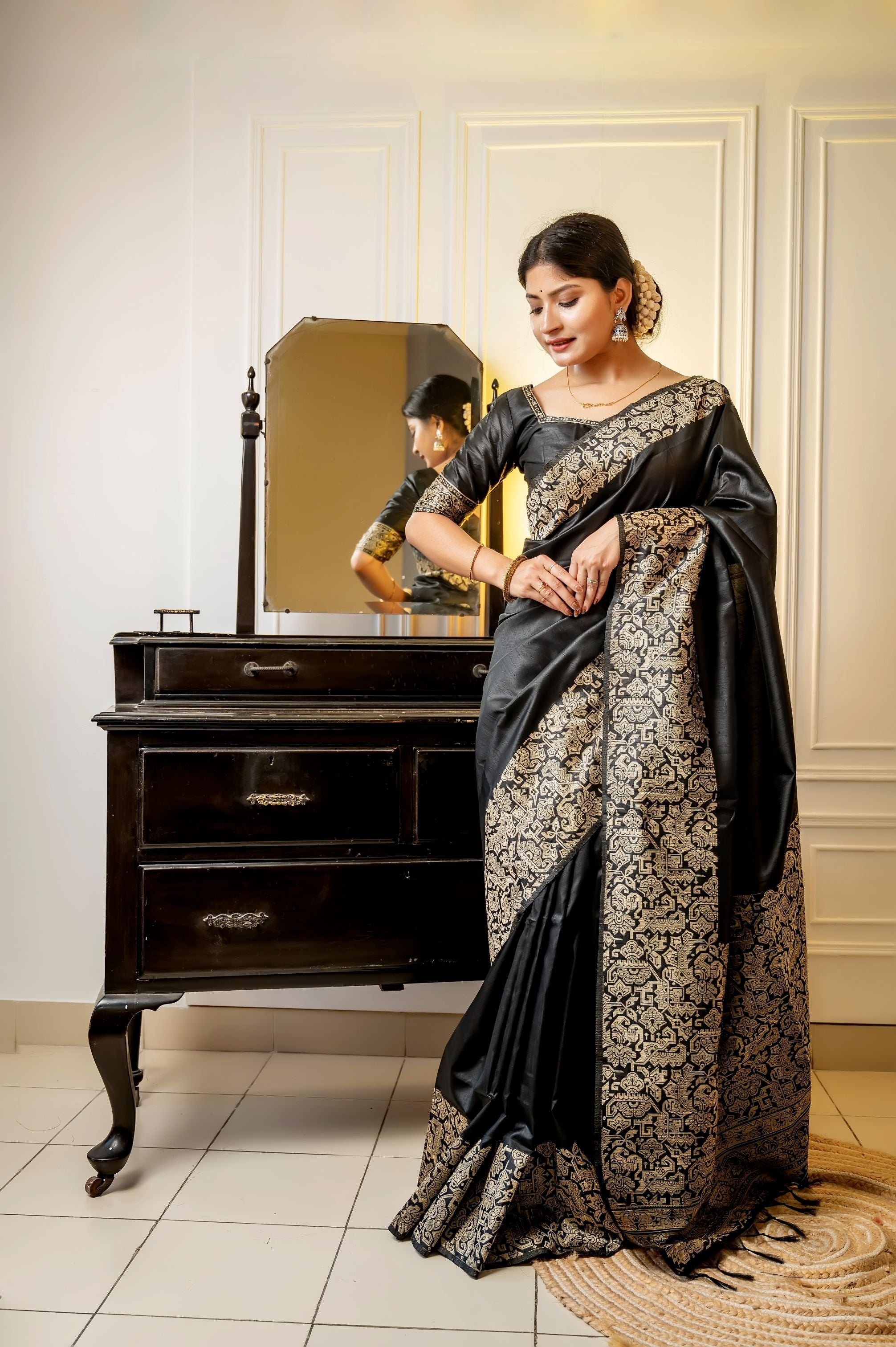 Black handloom raw silk saree with intricate weaving and designer finish