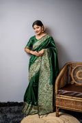 Bottle green handloom raw silk designer saree featuring exquisite weaving patterns.