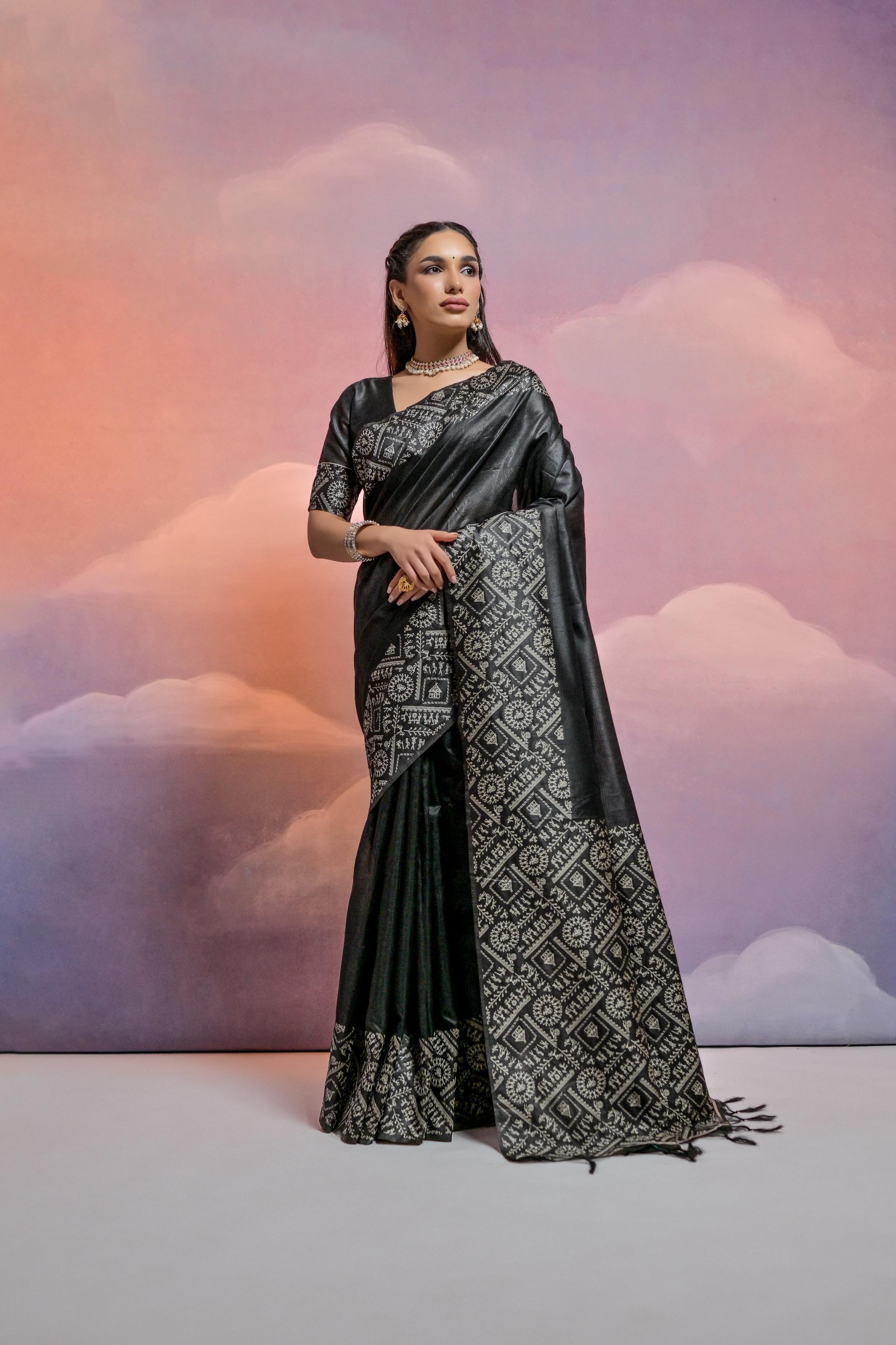 Black handloom raw silk designer saree featuring detailed weaving work with unstitched blouse