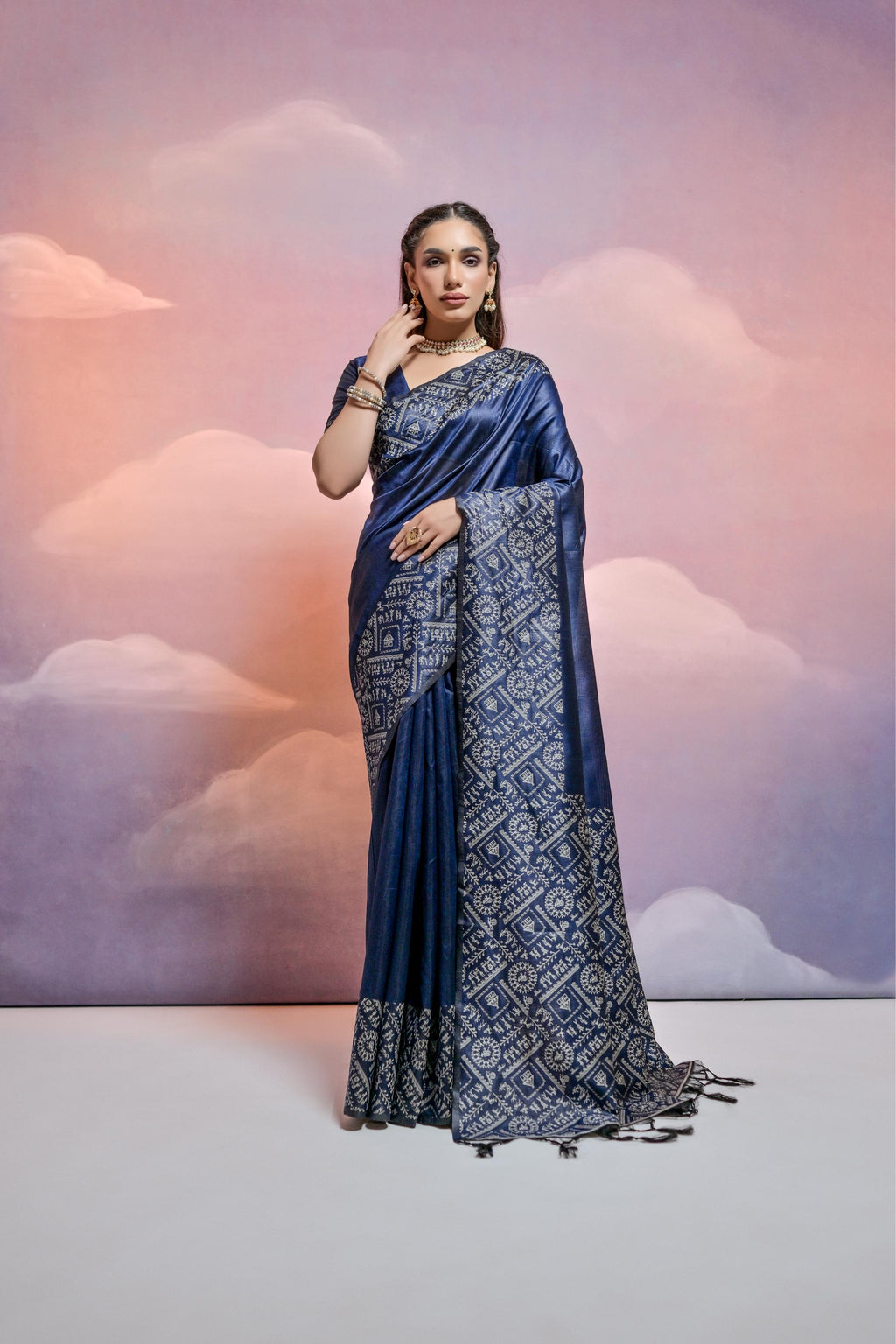 Navy blue handloom raw silk saree with detailed weaving and matching blouse fabric