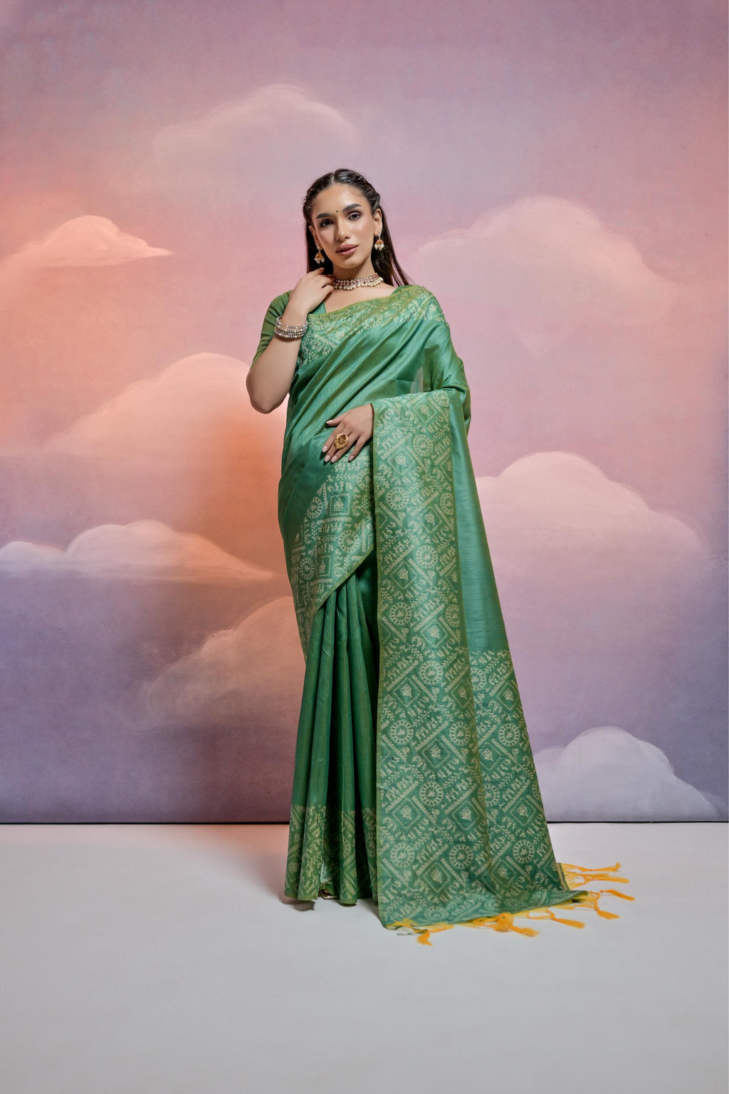 Green handloom raw silk designer saree with intricate weaving and matching unstitched blouse piece