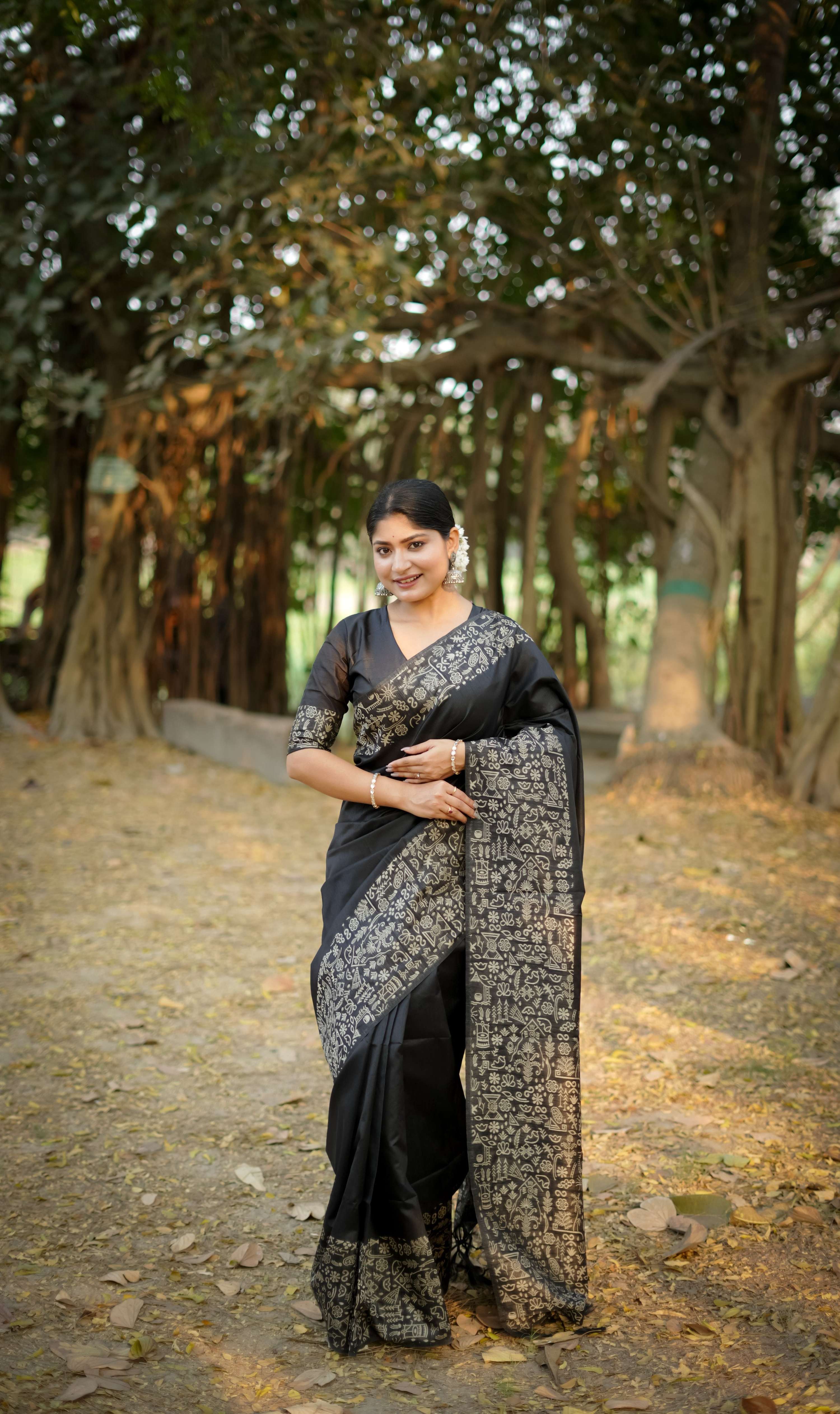 Black handloom raw silk designer saree featuring elegant weaving pallu