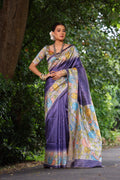 Purple soft Tussar silk saree with traditional Kalamkari prints and matching blouse fabric.