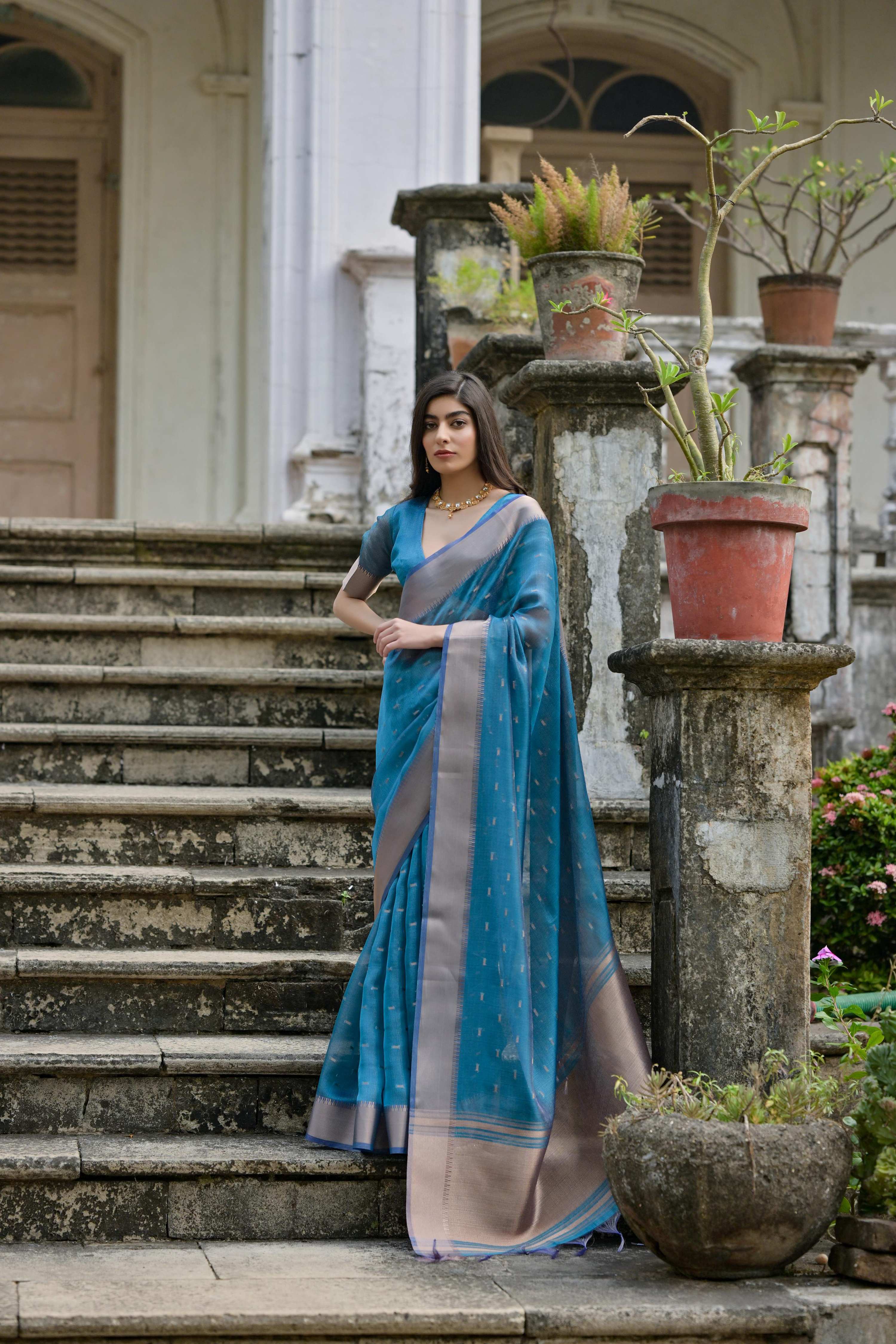 Firozi soft Kalyani silk saree with silver Zari woven details and matching blouse
