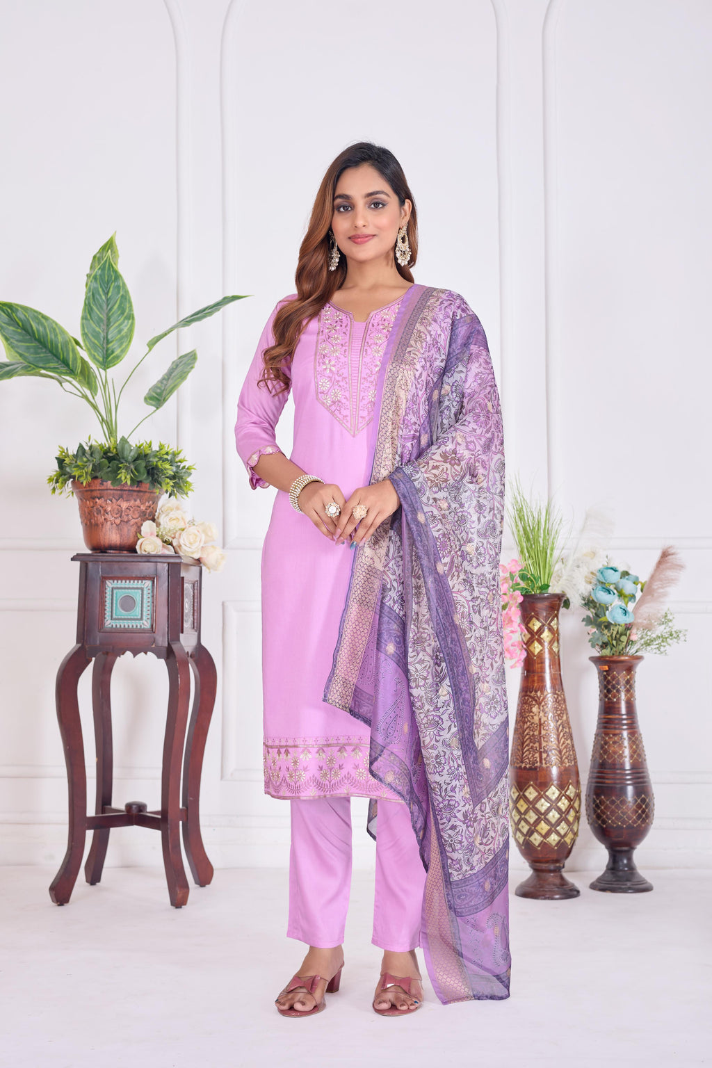 Women wearing a lavender cotton embroidered straight kurta set with matching dupatta