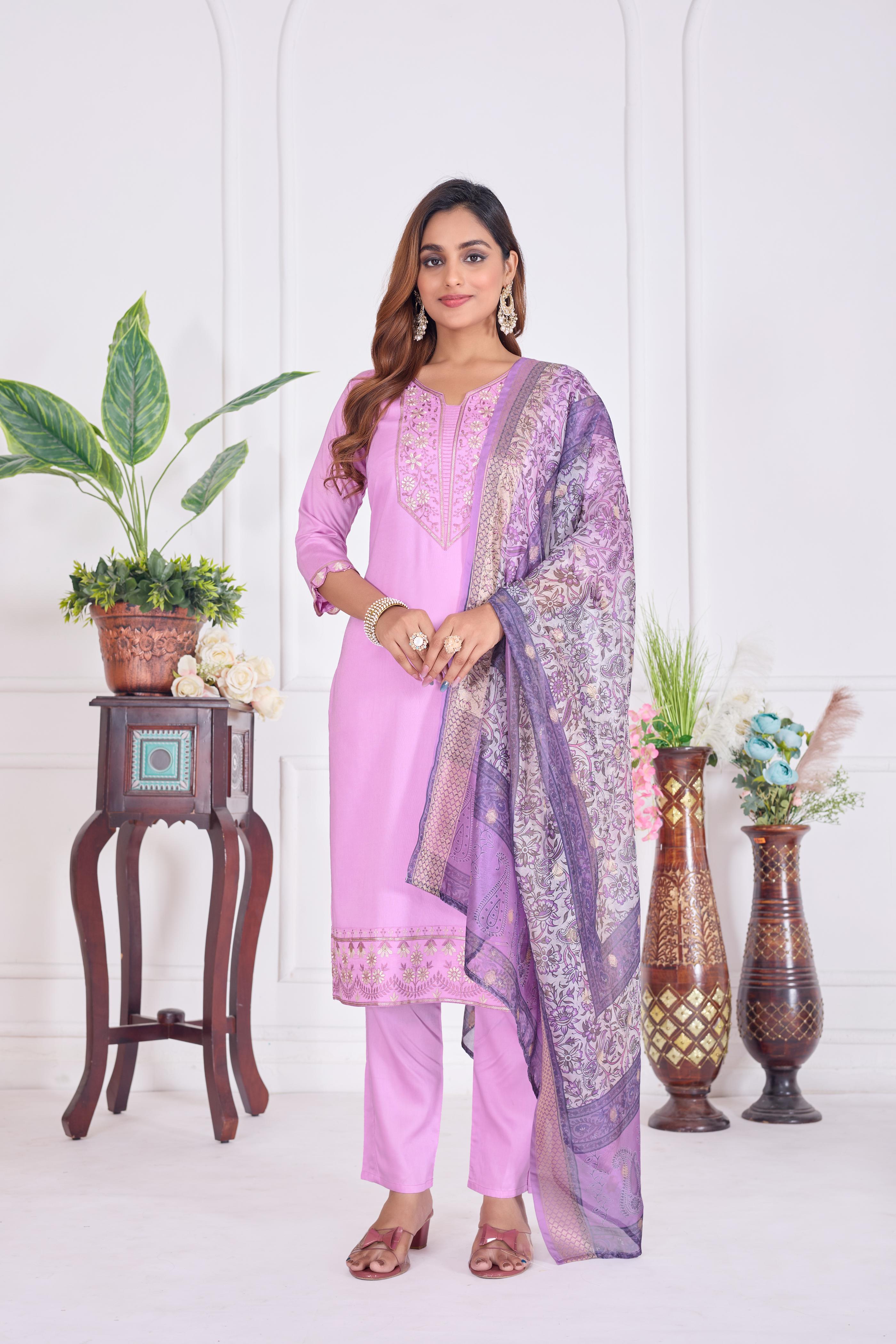 Women wearing a lavender cotton embroidered straight kurta set with matching dupatta