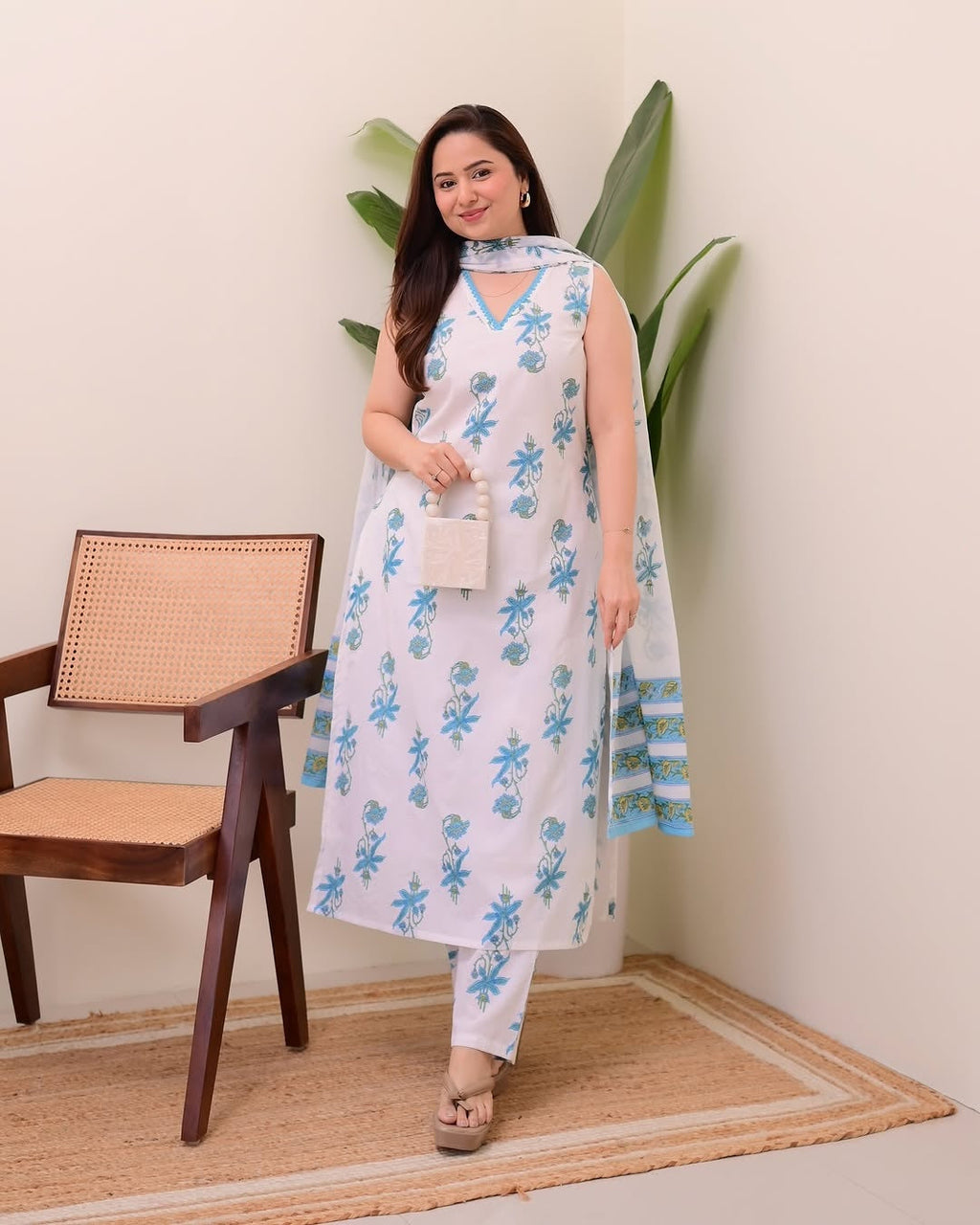Blue rayon slub straight kurta with floral print and V-neck styling paired with a dupatta.