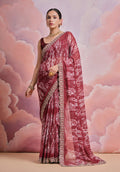 Elegant coffee colored georgette saree with sequence and zari codding work, paired with a matching blouse.