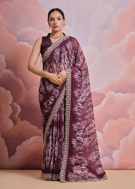 Wine colored georgette saree featuring detailed sequin and zari codding embroidery
