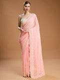 Elegant baby pink chiffon saree with intricate embroidery for formal Indian occasions