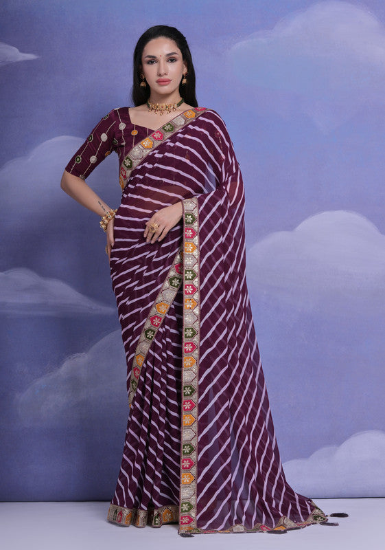 Wine-colored georgette saree with intricate multi-thread coding and sequence details