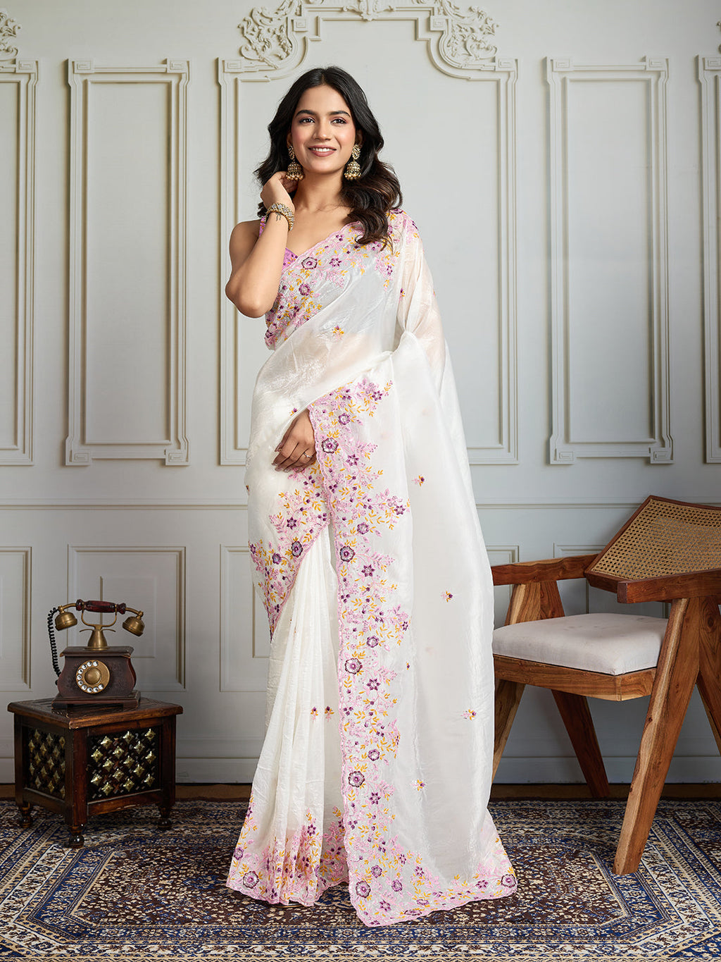 Sophisticated white gold crush designer saree with sequin and thread embroidery and a silk blouse.