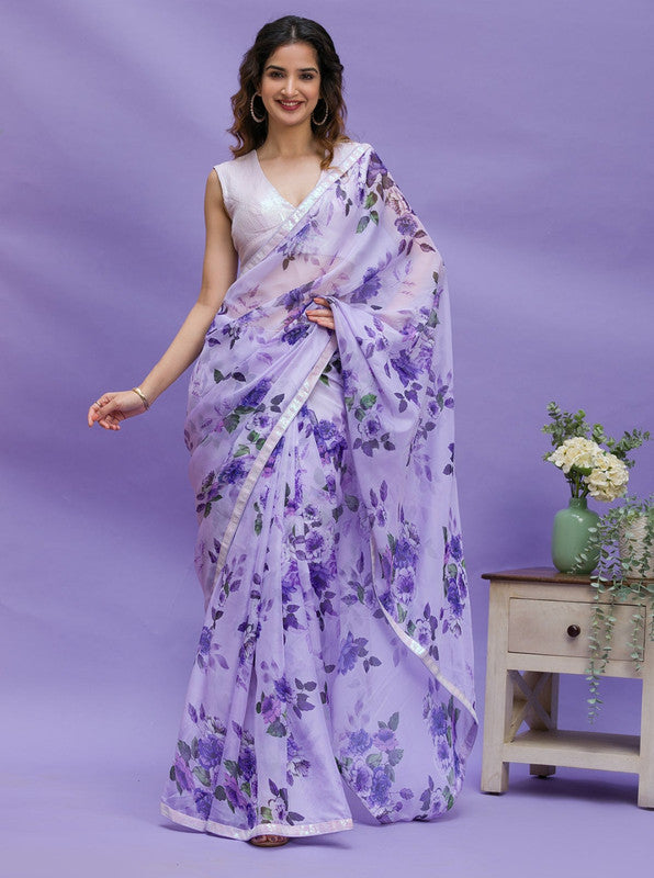 Elegant purple chinon saree with digital floral prints and intricate sequence lace work border, paired with a matching blouse.