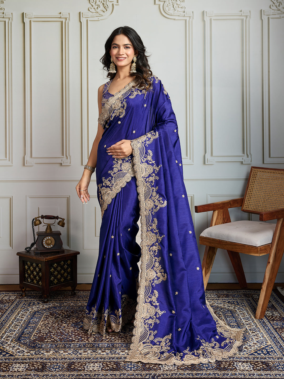 Luxurious blue Jimmy Choo silk designer saree adorned with coding sequins embroidery.