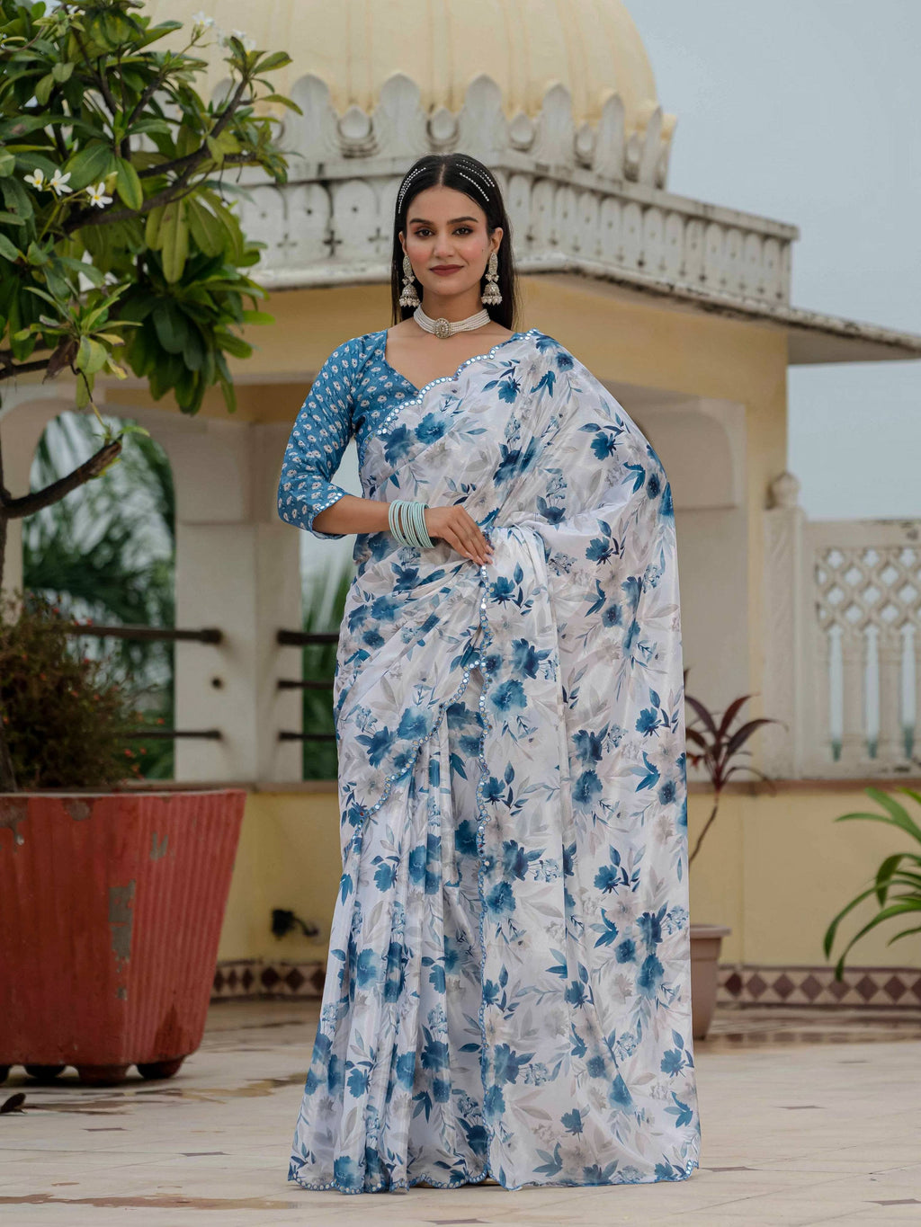 Elegant blue Chinon saree with digital print and mirror work, paired with a matching blouse.