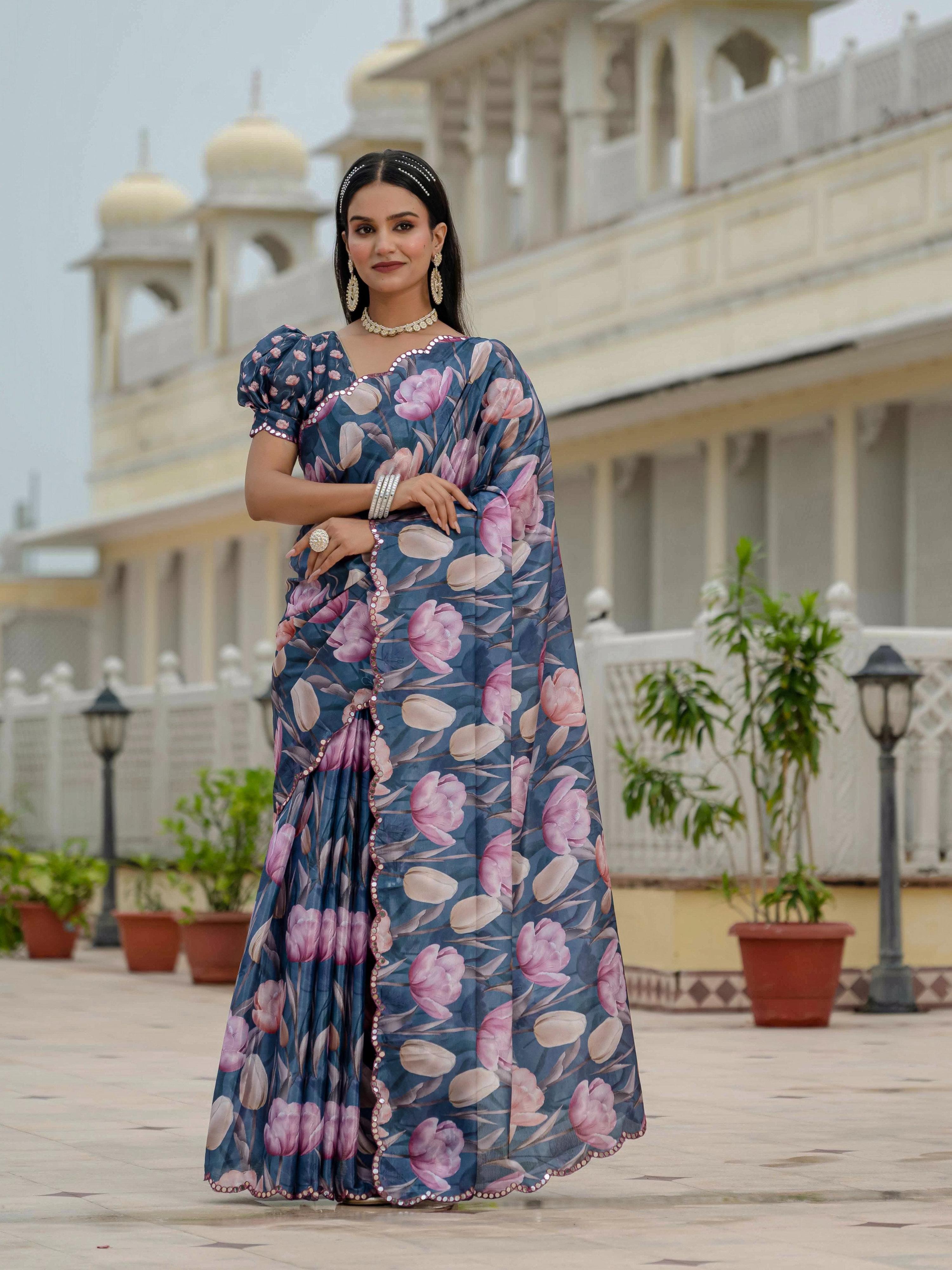 Navy Blue Chinon saree with digital print and mirror work details paired with an unstitched blouse piece