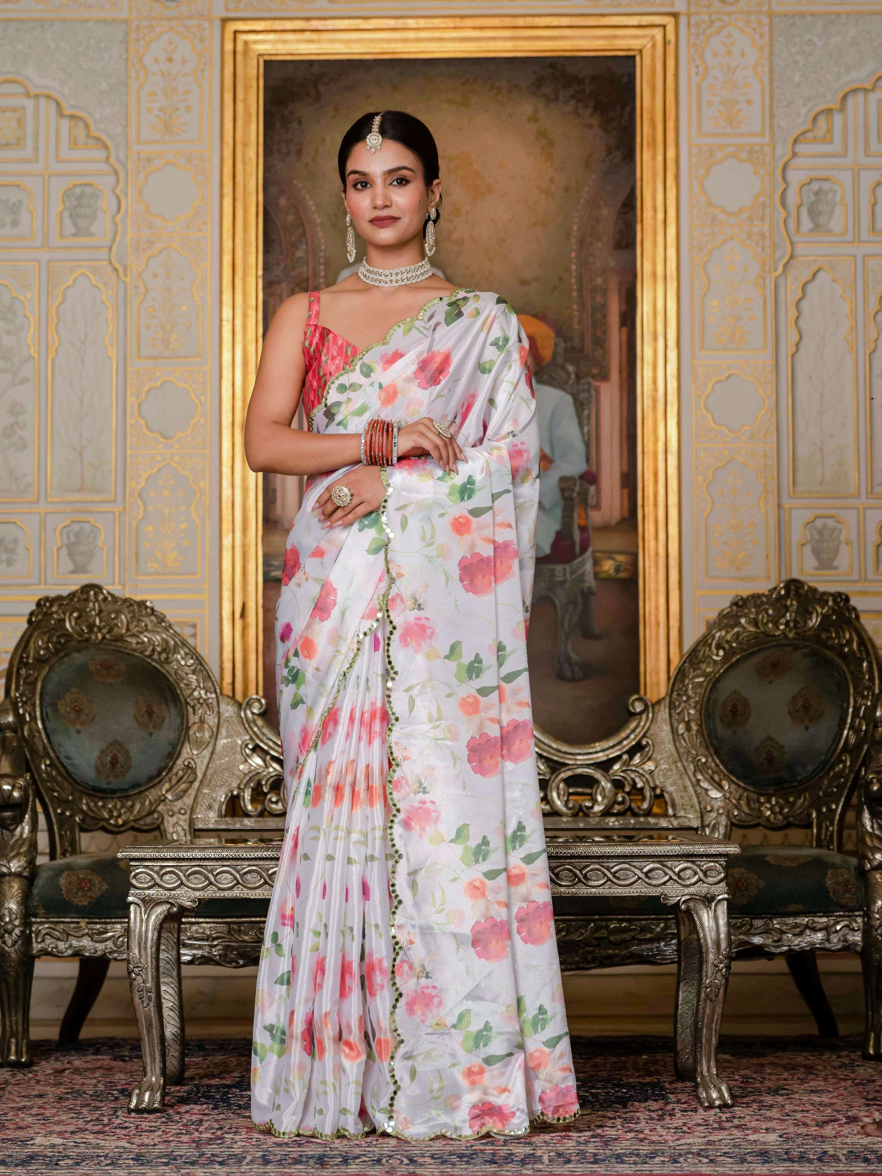 White Chinon saree with digital floral prints and detailed mirror work, including a blouse