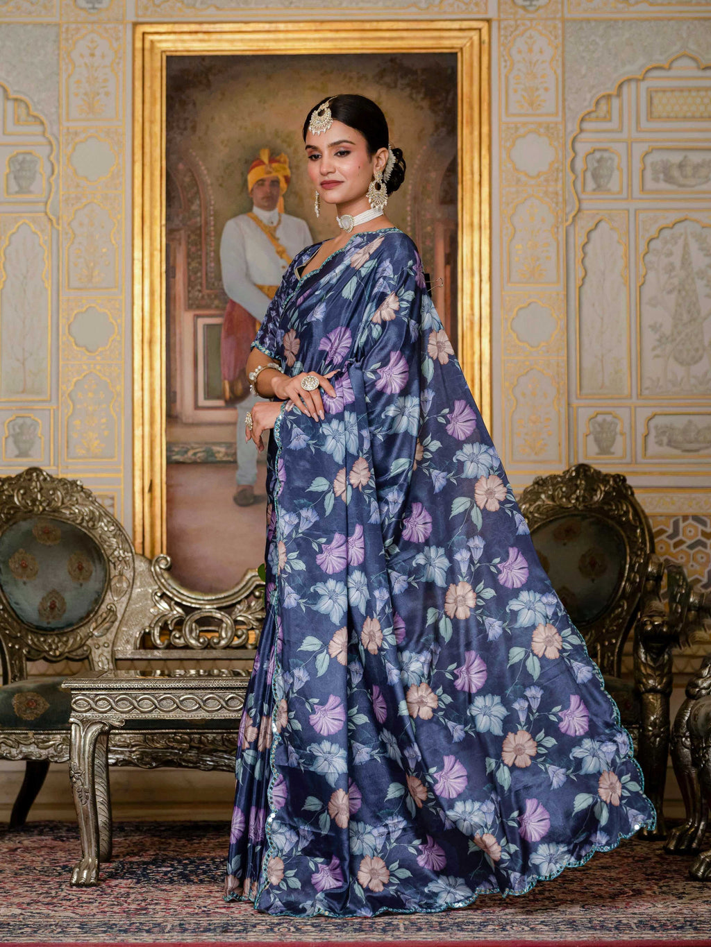 Navy blue Chinon saree featuring digital prints and mirror work embellishments.