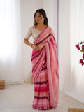 Pink Chinon saree with Leriya print, Zari details, and decorative paper mirror border.