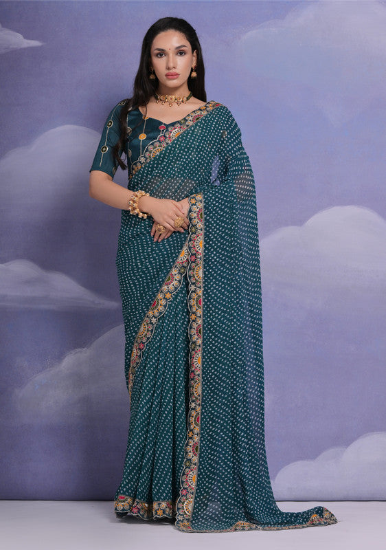 Teal georgette saree featuring multi-color dhaga and coding sequence embroidery