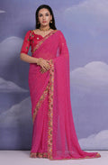 Rani pink georgette saree featuring intricate multi-thread and sequence coding embroidery.