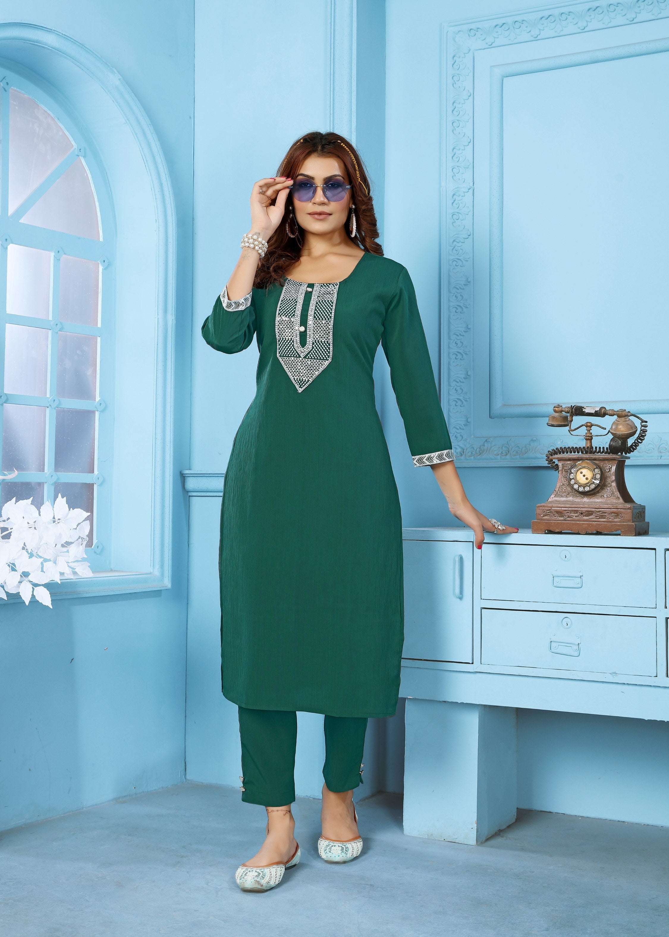 Bottle green Rinkal cotton kurta set with intricate embroidery and matching bottom.