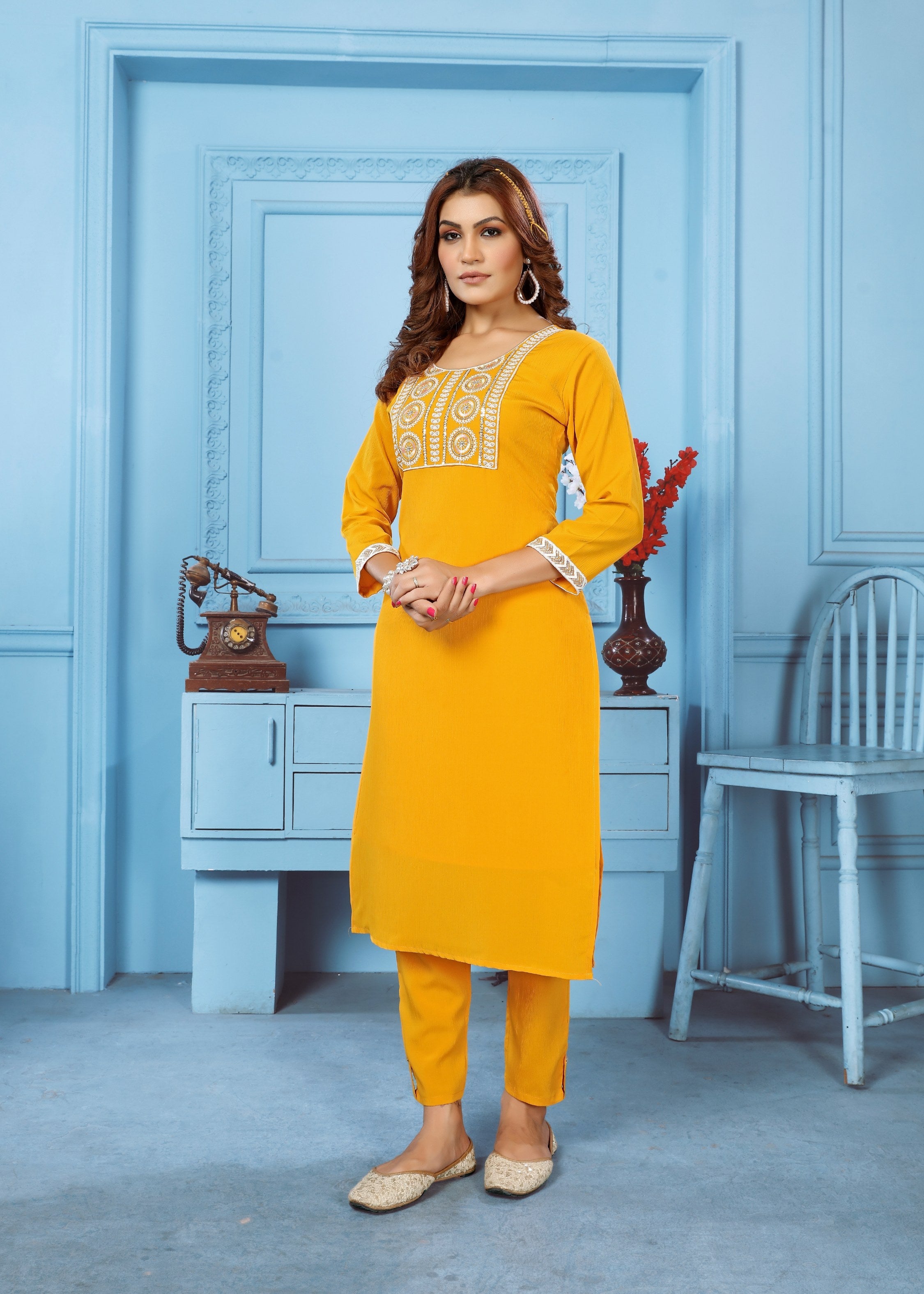Yellow Rinkal cotton kurta with embroidery paired with a matching bottom.