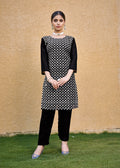 A black faux georgette kurta set showcasing detailed chikan embroidery work.