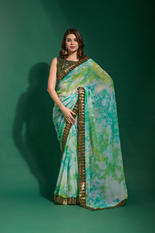 Sea green chiffon saree with sequence embroidery, complete with a matching blouse piece.