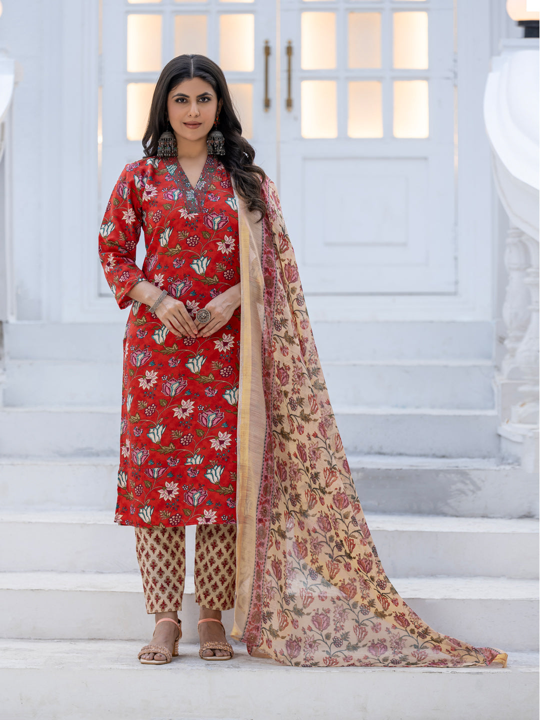 Women's red rayon kurta set featuring intricate threadwork and print
