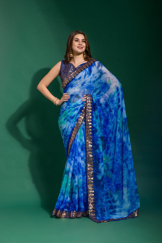 Blue chiffon saree with shimmering sequence embroidery and matching blouse