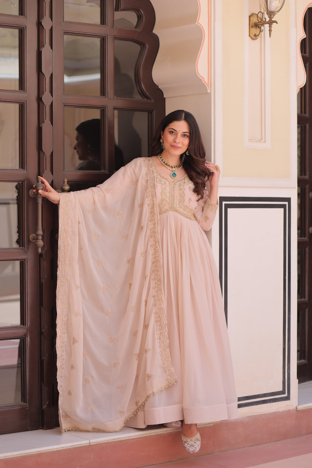 Elegant beige star georgette Anarkali set with intricate bead and sequin embroidery.