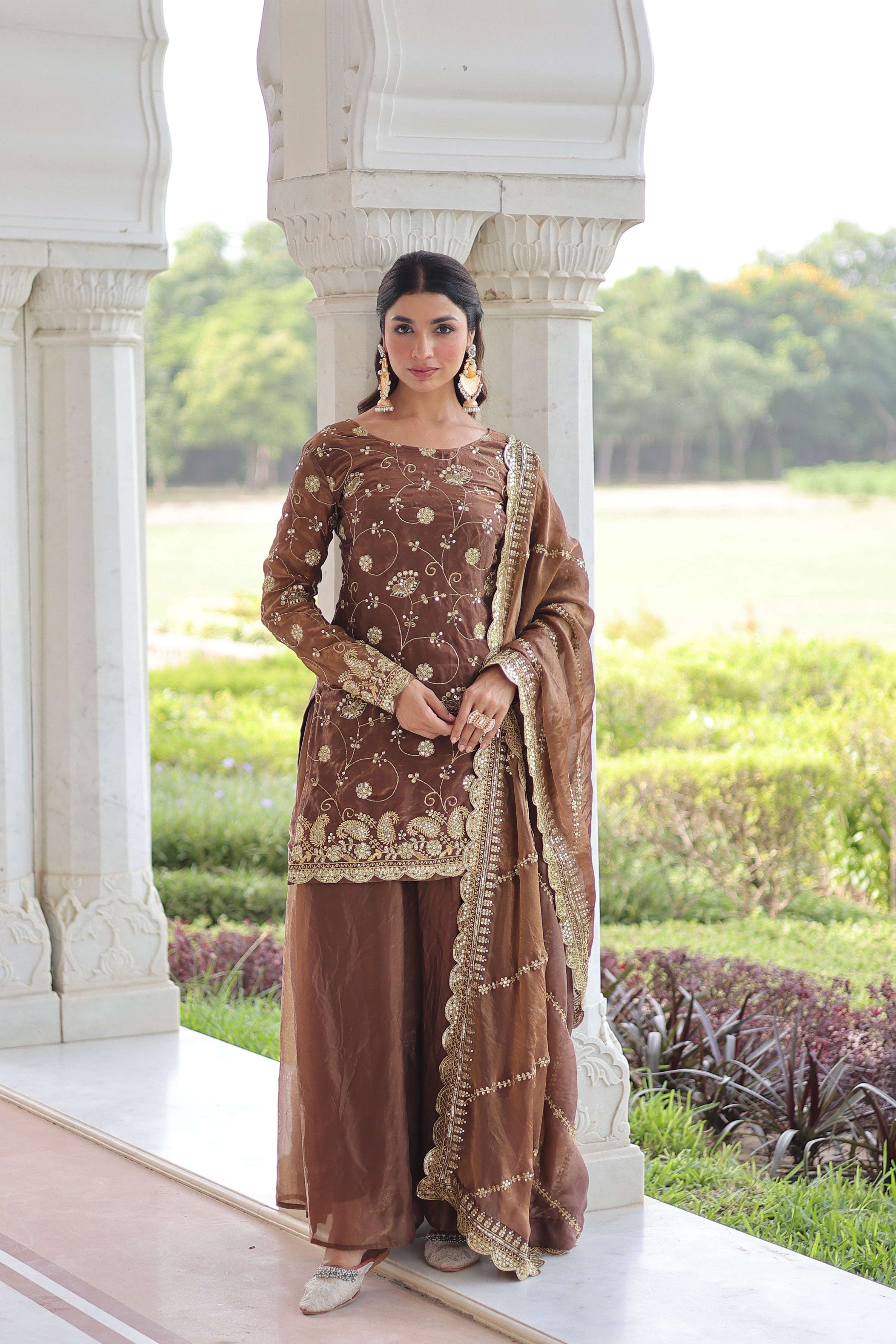 Woman wearing a Coffee Fendy designer kurta set with intricate sequins embroidery and matching dupatta