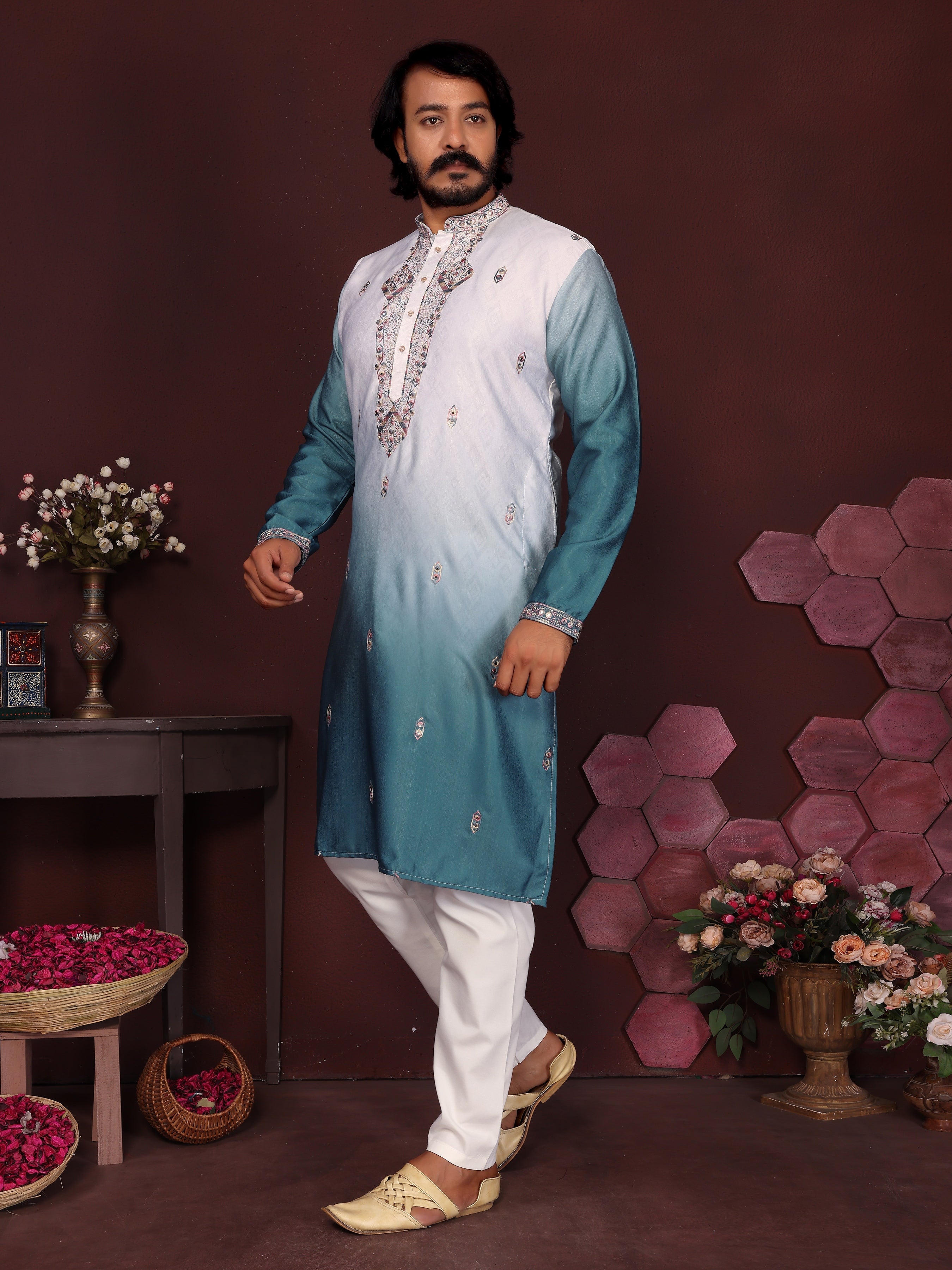 Men wearing a teal knee-length kurta with sequins embroidery and matching pajama