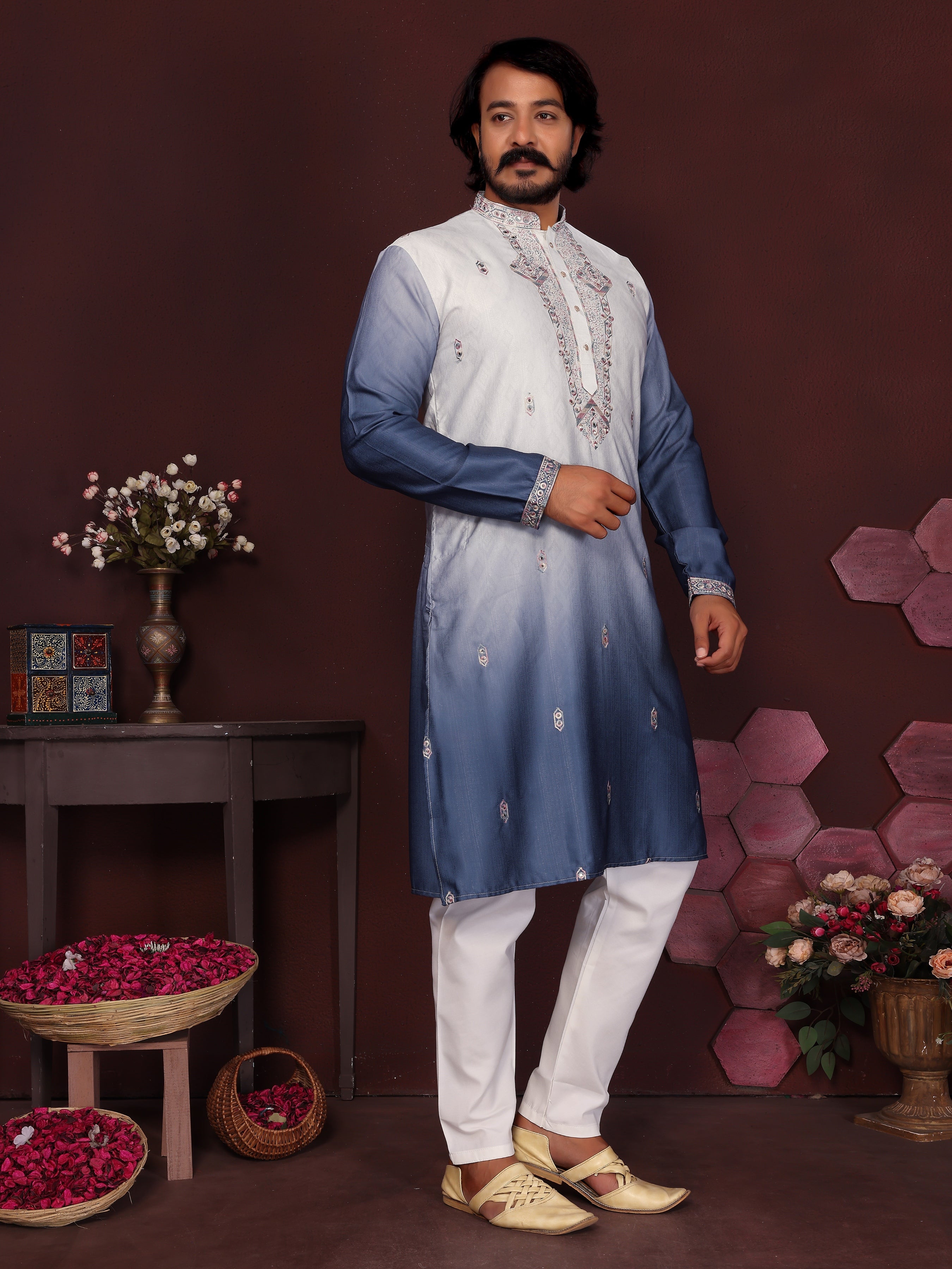 Toddler boy wearing a blue knee-length kurta with sequins embroidery and matching pajama pants