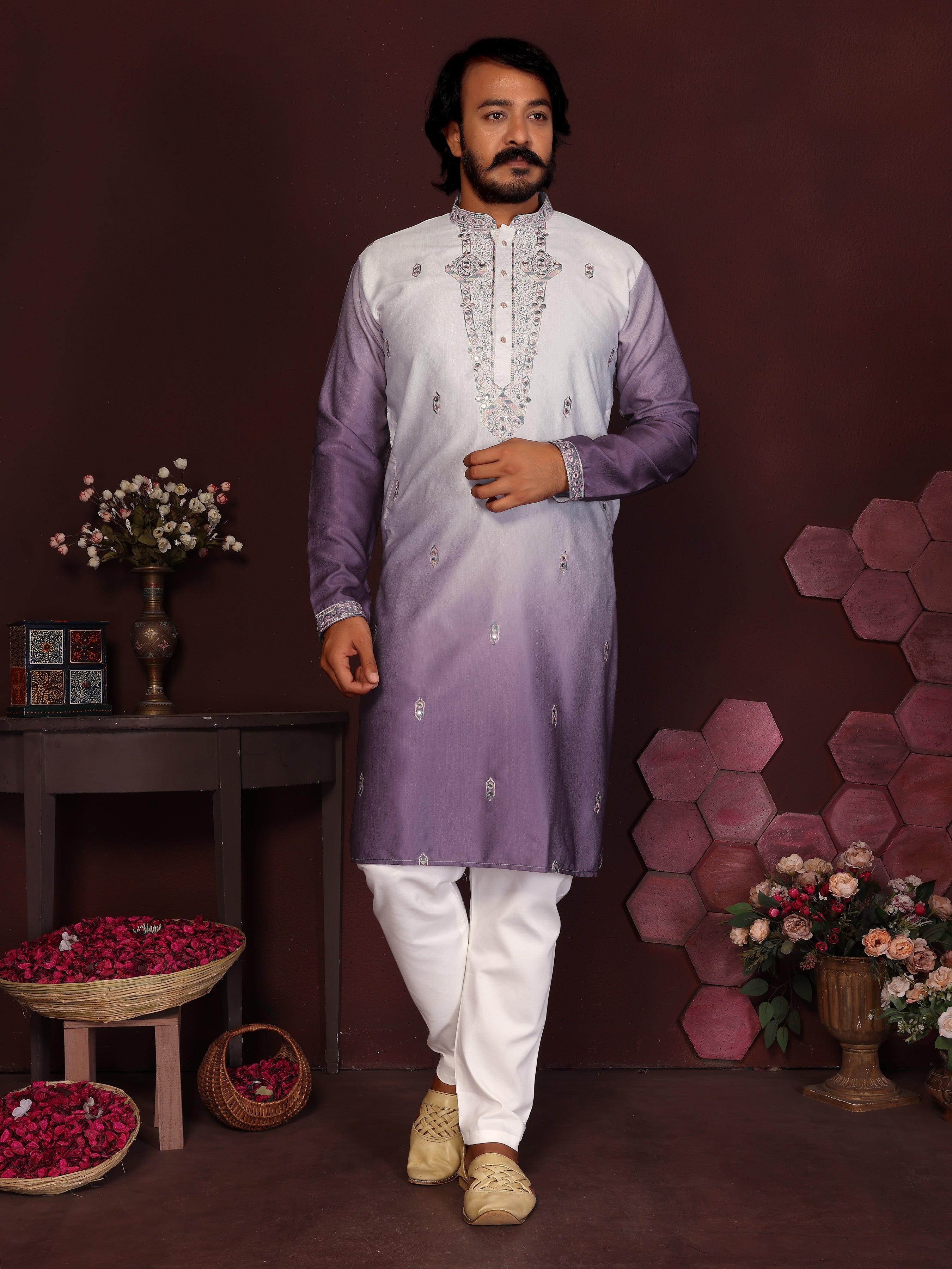 Men wearing a Jamuni color kurta with intricate sequins embroidery and matching pajamas